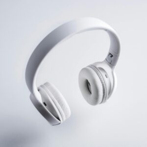 Floating white wireless headphones on a minimalist white background. Perfect for tech promotions.