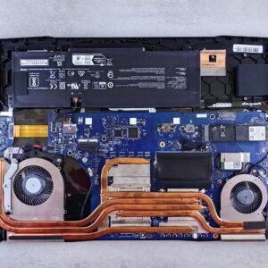 Detailed view of laptop motherboard and cooling system components.